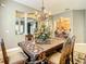 Traditional dining room area features a large wood table and views into the kitchen at 4737 Casswell Dr, New Port Richey, FL 34652