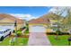 Charming home featuring a two-car garage, landscaped yard, brick driveway, and well-maintained exterior at 4737 Casswell Dr, New Port Richey, FL 34652