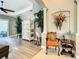 Hallway featuring tile and wood flooring, plus view of living room with sliding glass door at 4737 Casswell Dr, New Port Richey, FL 34652