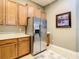 Bright kitchen featuring stainless steel appliances, light wood cabinetry, and bright countertops at 4737 Casswell Dr, New Port Richey, FL 34652