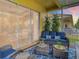 Relaxing screened lanai featuring stylish outdoor furniture and a view of the manicured backyard at 4737 Casswell Dr, New Port Richey, FL 34652