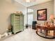 Bright office space with a desk, armoire, artwork, and ample natural light at 4737 Casswell Dr, New Port Richey, FL 34652