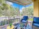 Relaxing screened patio with comfortable seating and clear outdoor views at 4737 Casswell Dr, New Port Richey, FL 34652
