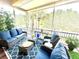 Comfortable screened patio with ample seating and a peaceful, breezy ambiance at 4737 Casswell Dr, New Port Richey, FL 34652