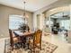 Bright dining room with a formal table, chandelier, view of living room at 4737 Casswell Dr, New Port Richey, FL 34652