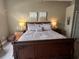Spacious main bedroom with a king-size bed and wood furniture at 4737 Casswell Dr, New Port Richey, FL 34652