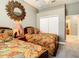 Guest bedroom with twin beds, and en-suite bathroom access at 4737 Casswell Dr, New Port Richey, FL 34652