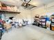 Garage with overhead storage and ample shelving at 4737 Casswell Dr, New Port Richey, FL 34652