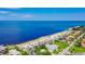 Aerial view of waterfront property with beach access and boat at 4737 Casswell Dr, New Port Richey, FL 34652