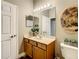 Well-lit bathroom with single vanity and a large mirror at 4737 Casswell Dr, New Port Richey, FL 34652