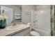 Clean bathroom with a shower/tub combo and updated fixtures at 708 160Th E Ln, Bradenton, FL 34212