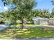 Exterior view of a mobile home with a yard and street view at 12501 Holyoke Ave, Tampa, FL 33624