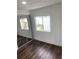 Bright bedroom with mirrored closet and wood-look flooring at 12501 Holyoke Ave, Tampa, FL 33624