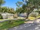 Aerial view of two mobile homes with surrounding trees and street at 12501 Holyoke Ave, Tampa, FL 33624