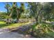Exterior view of a mobile home with a yard and street view at 12501 Holyoke Ave, Tampa, FL 33624