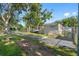 Exterior view of a mobile home with a yard and driveway at 12501 Holyoke Ave, Tampa, FL 33624