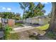 Exterior view of a mobile home with a yard and walkway at 12501 Holyoke Ave, Tampa, FL 33624