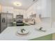 Updated kitchen with white cabinets and quartz countertops at 3822 Cortez Dr # D, Tampa, FL 33614