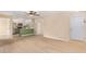Light and airy living room with new flooring and ceiling fan at 3822 Cortez Dr # D, Tampa, FL 33614