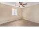 Bright bedroom with light walls, wood-look floors, and window blinds at 3822 Cortez Dr # D, Tampa, FL 33614