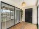 Screened porch with glass sliding door and a view of the courtyard at 3822 Cortez Dr # D, Tampa, FL 33614