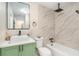 Modern bathroom with green vanity, white vessel sink, and walk-in shower at 3822 Cortez Dr # D, Tampa, FL 33614