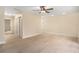Light beige living room with wood-look floors and ceiling fan at 3822 Cortez Dr # D, Tampa, FL 33614