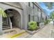 Gray condo building with stairs and landscaping at 3822 Cortez Dr # D, Tampa, FL 33614