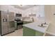 Modern kitchen with stainless steel appliances and green cabinets at 3822 Cortez Dr # D, Tampa, FL 33614