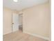 Spacious bedroom with light walls, wood-look floors, and an adjacent room at 3822 Cortez Dr # D, Tampa, FL 33614