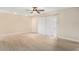 Bright bedroom with light wood-look floors and ceiling fan at 3822 Cortez Dr # D, Tampa, FL 33614