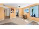 Open-concept room seamlessly connecting to the kitchen, with neutral walls and a view of the outside at 4550 Cove Cir # 501, St Petersburg, FL 33708