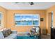 Cozy living room with water view, bright natural light, comfortable furnishings, and a calming atmosphere at 4550 Cove Cir # 501, St Petersburg, FL 33708