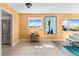 Comfortable room featuring hard flooring, large art piece, and neutral walls, with a view of the water at 4550 Cove Cir # 501, St Petersburg, FL 33708