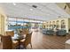 Bright and airy lounge area with comfortable seating, bookshelves, and expansive water views at 4550 Cove Cir # 501, St Petersburg, FL 33708