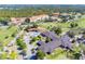 Aerial view of clubhouse featuring pool, lush green golf course, and luxury hotel in community at 6924 Greenhill Pl, Tampa, FL 33617