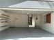 Spacious garage interior with shelving, and plenty of room for vehicles and storage at 6924 Greenhill Pl, Tampa, FL 33617
