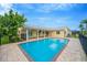 Inviting pool with spacious patio and canal views at 916 Eagle Ln, Apollo Beach, FL 33572