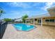 Stunning pool and patio overlooking the canal at 916 Eagle Ln, Apollo Beach, FL 33572