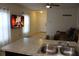 Kitchen with a breakfast bar and view into the living room at 11919 Grand Kempston Dr, Gibsonton, FL 33534