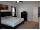 Main bedroom with king-size bed, dresser, and additional closet space at 11919 Grand Kempston Dr, Gibsonton, FL 33534
