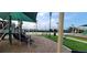 playground with shaded areas at 11919 Grand Kempston Dr, Gibsonton, FL 33534