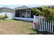Screened patio with fenced backyard and landscaping at 11919 Grand Kempston Dr, Gibsonton, FL 33534