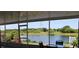 Spacious screened patio with lake view and seating area at 11919 Grand Kempston Dr, Gibsonton, FL 33534