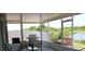 Screened patio with grill and comfortable seating at 11919 Grand Kempston Dr, Gibsonton, FL 33534