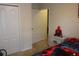 Spacious bedroom with ample closet space and adjoining room at 11919 Grand Kempston Dr, Gibsonton, FL 33534