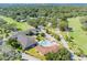 Aerial view showing clubhouse, pool, and surrounding landscape at 6924 Greenhill Pl, Tampa, FL 33617