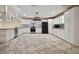 Modern white kitchen with granite countertops at 6924 Greenhill Pl, Tampa, FL 33617