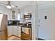 Modern kitchen with stainless steel appliances and ample cabinet space at 12760 Indian Rocks Rd # 910, Largo, FL 33774