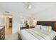 Bedroom with mirrored closet doors and a comfortable bed at 12760 Indian Rocks Rd # 910, Largo, FL 33774